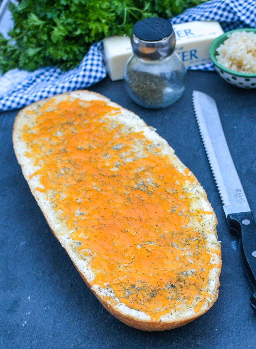 cheesy ranch bread on a black slate cutting board