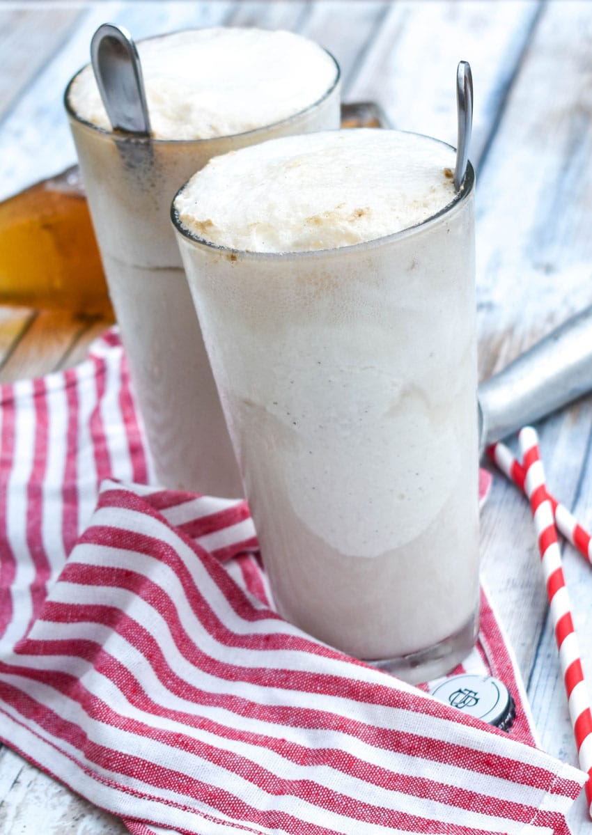 two cream soda ice cream floats in tall glasses