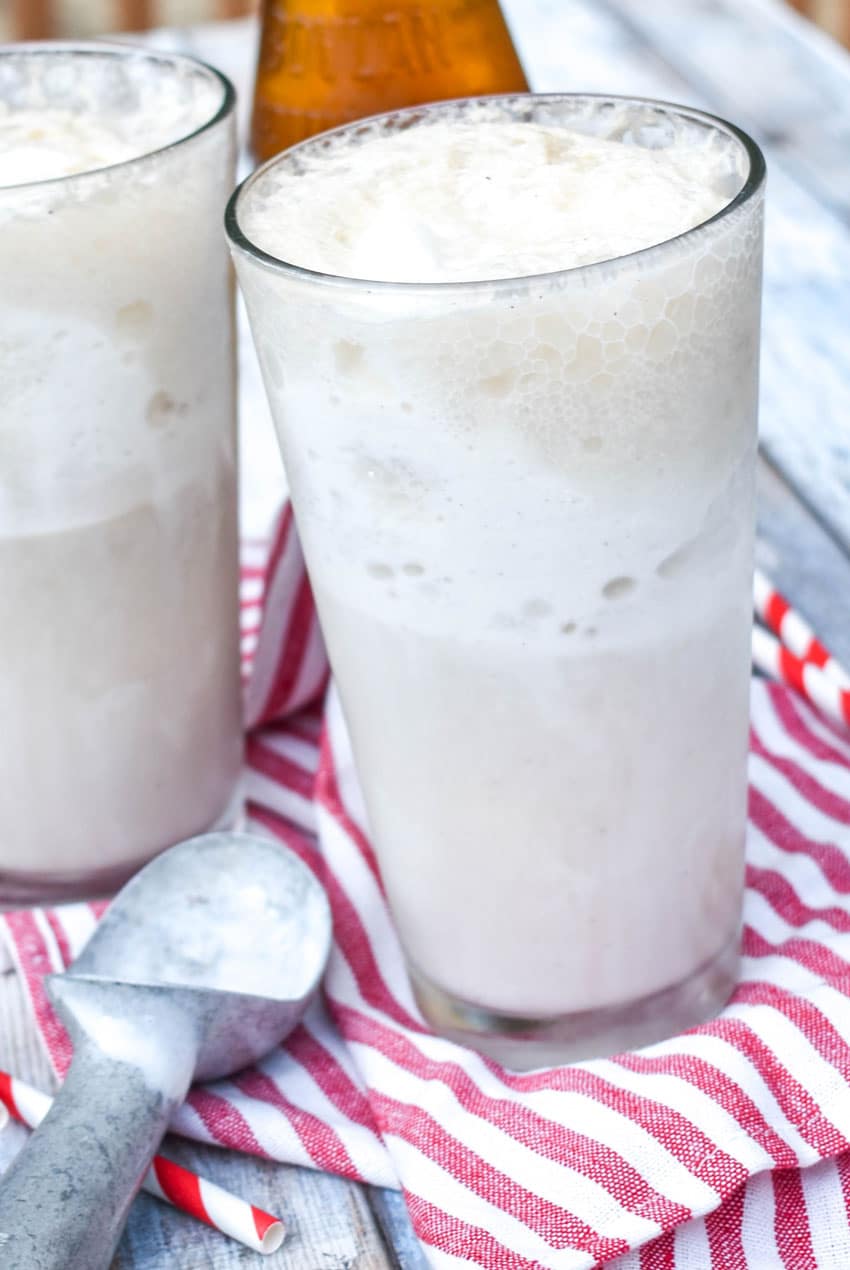 two cream soda ice cream floats in tall glasses