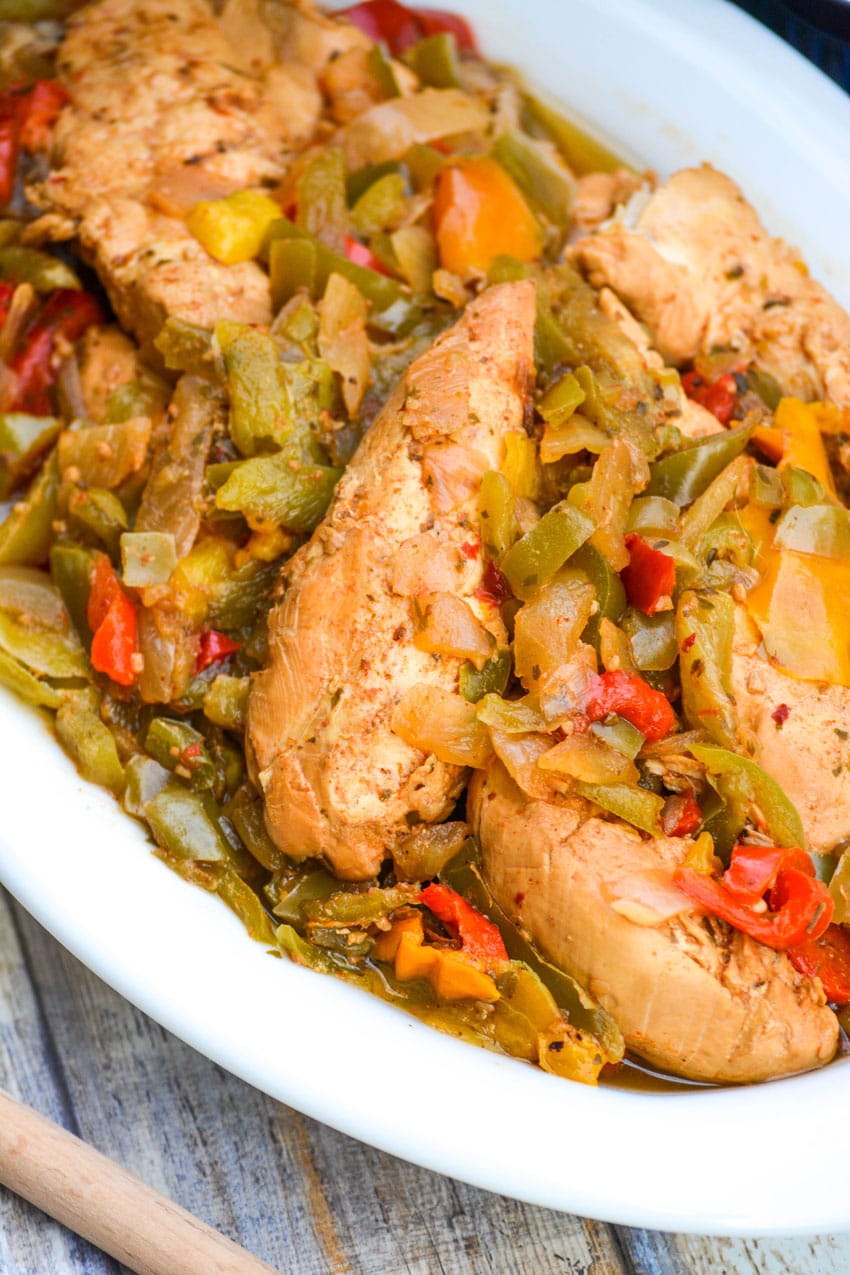slow cooker chicken fajitas in a white serving bowl
