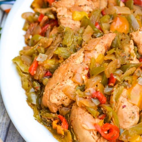 slow cooker chicken fajitas in a white serving bowl