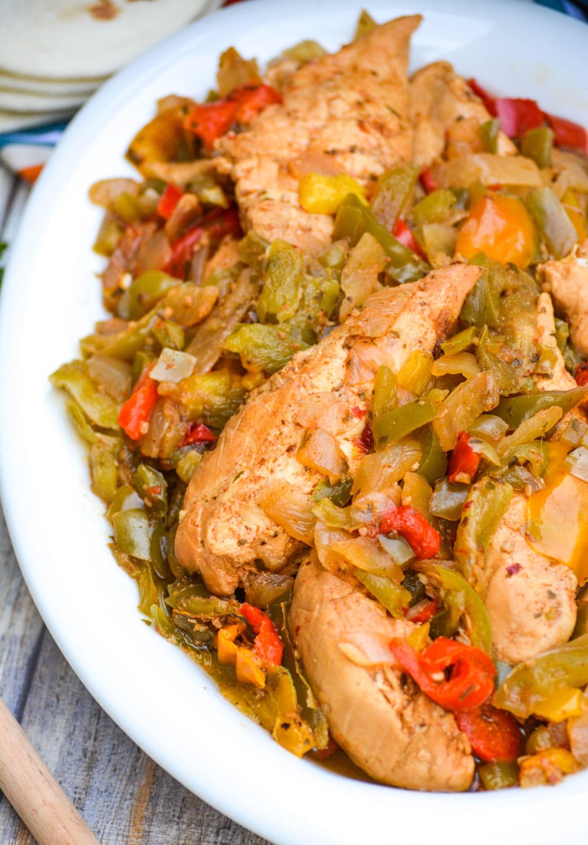 Slow Cooker Chicken Fajitas slow cooker chicken fajitas in a white serving bowl