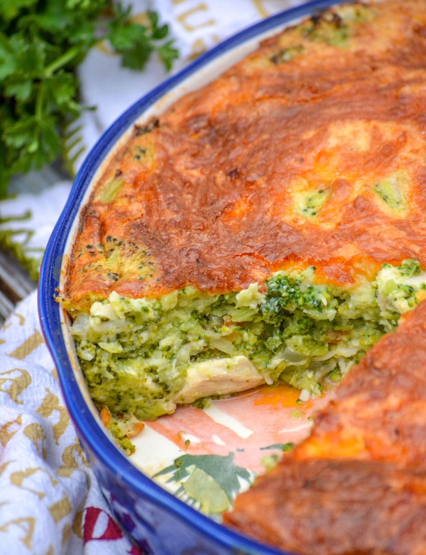cheesy chicken and broccoli pie in a blue pie dish