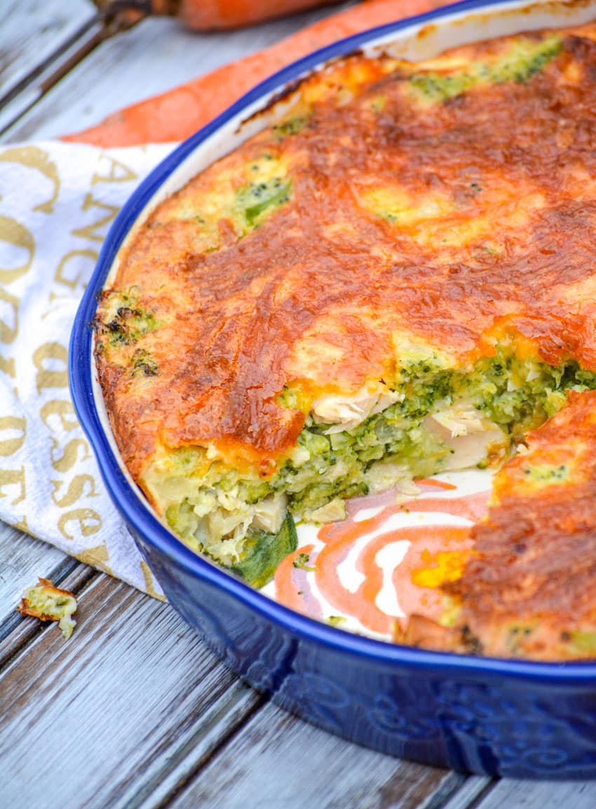 cheesy chicken and broccoli pie in a blue pie dish