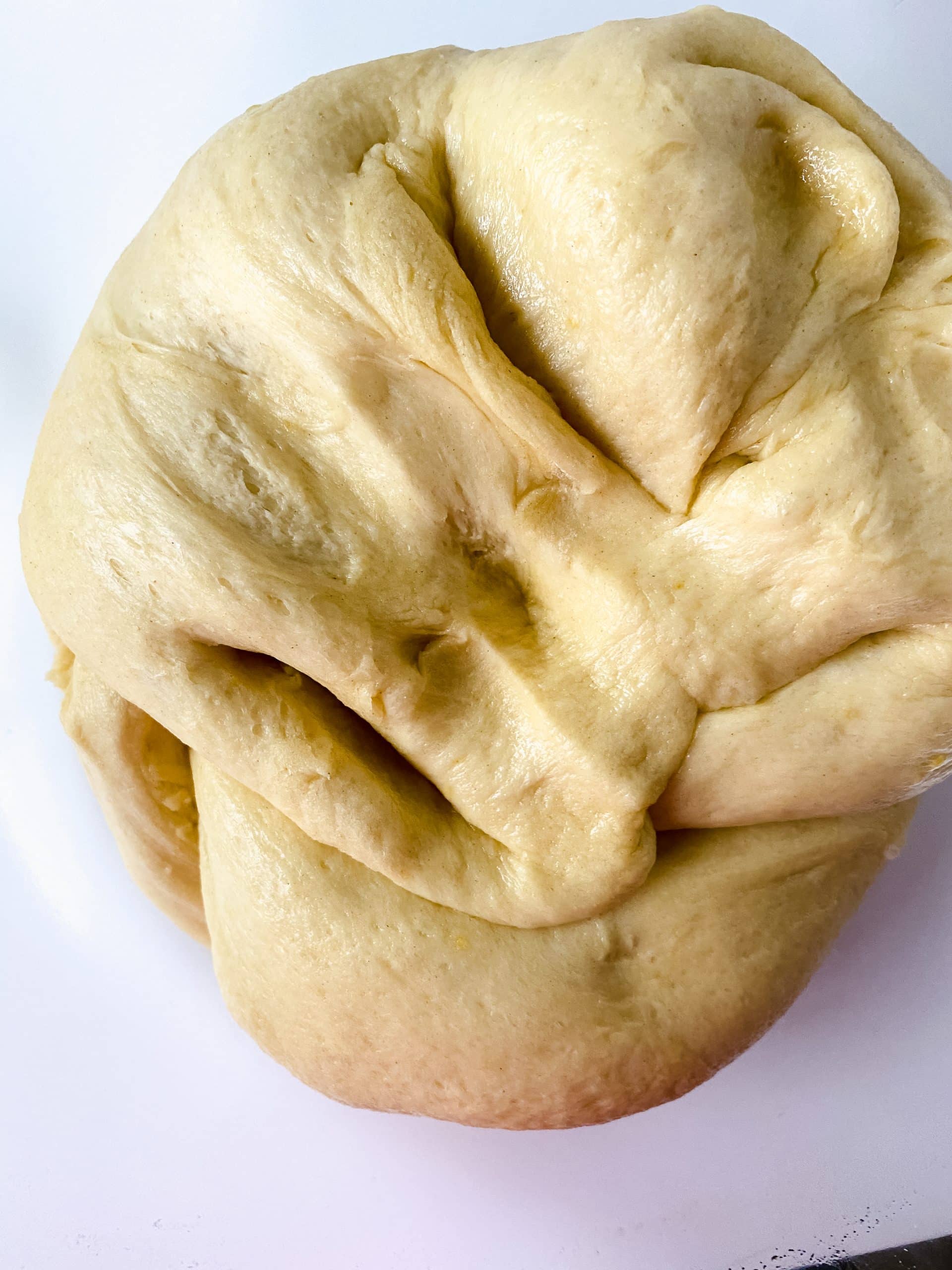 homemade danish pastry dough on a white counter top
