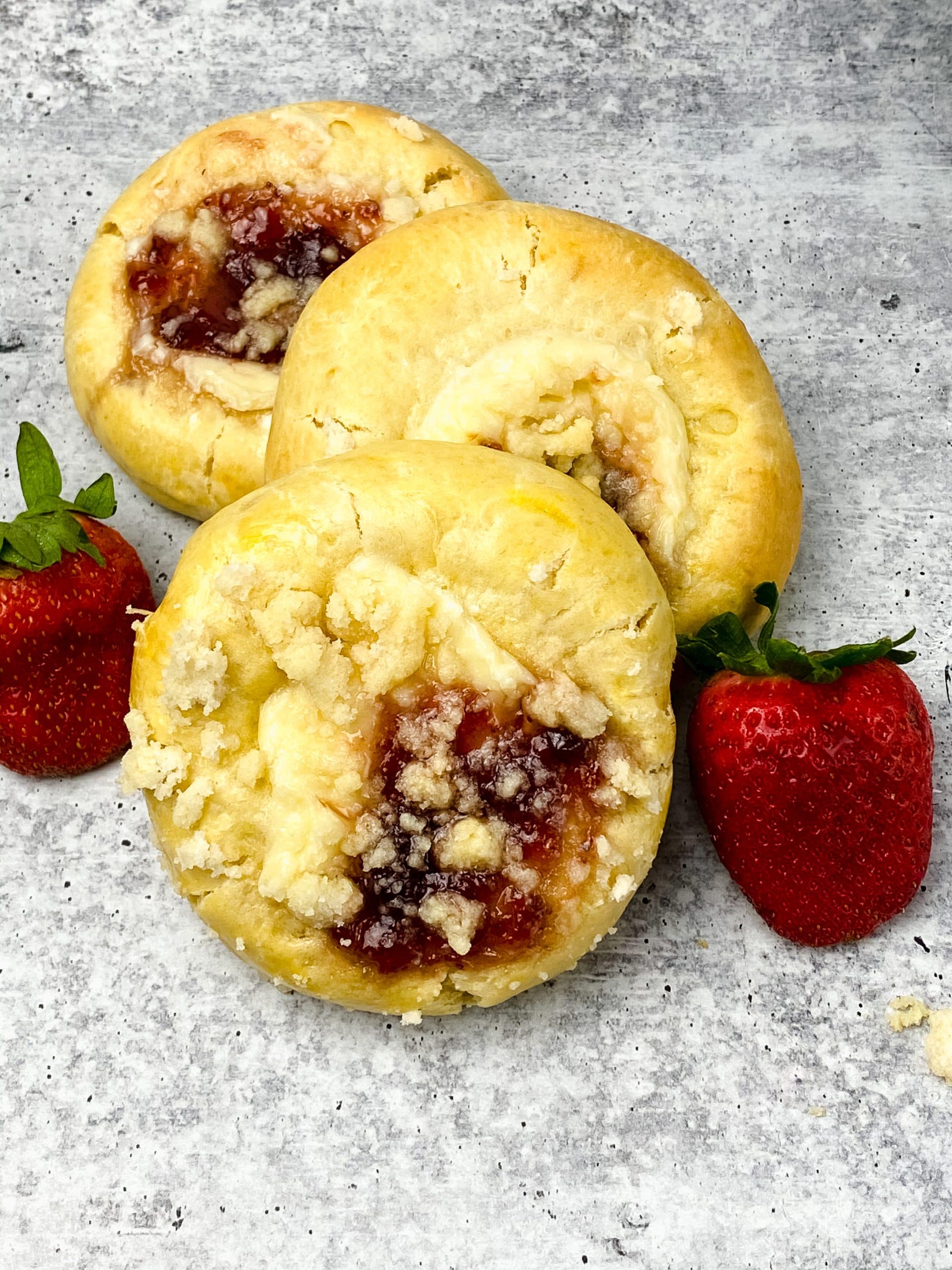 homemade strawberry cream cheese danishes next to fresh berries