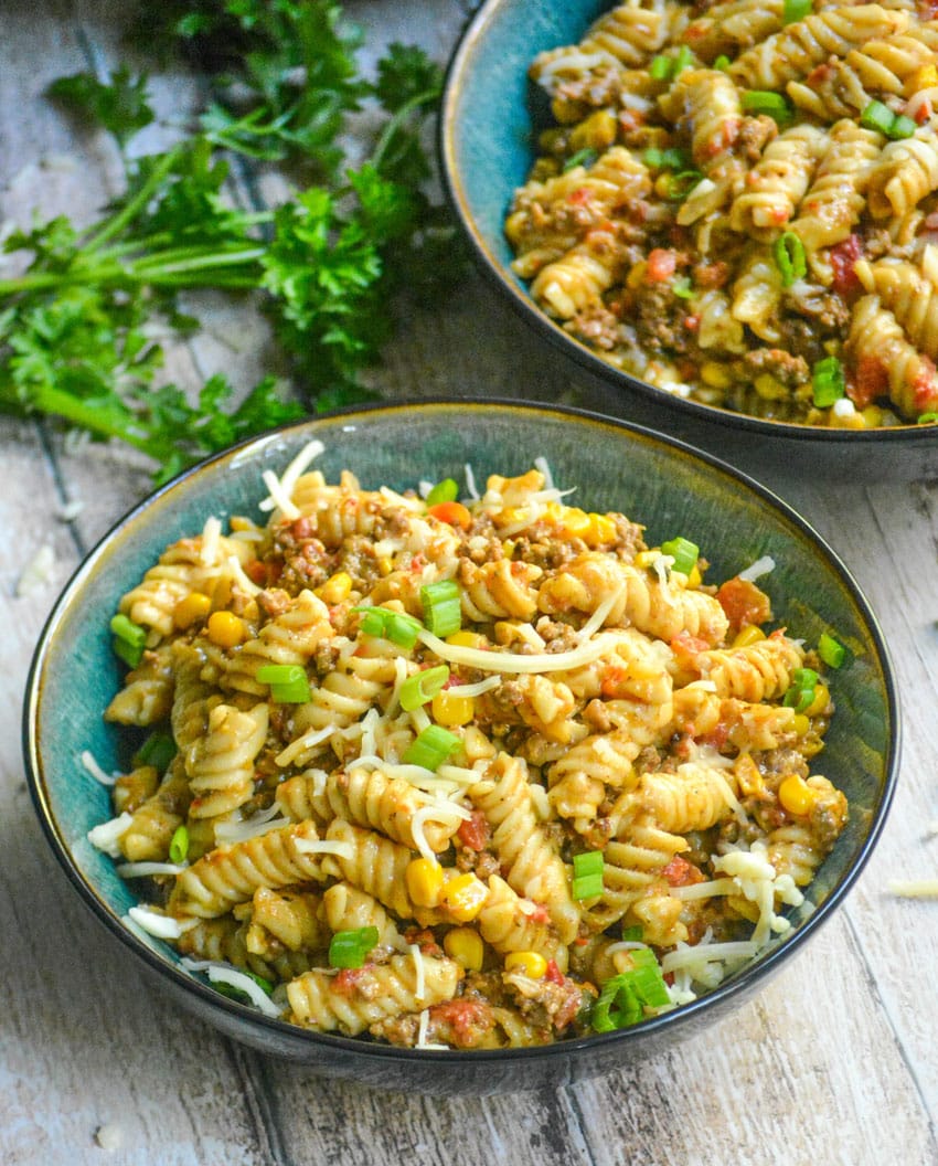 instant pot taco pasta in two green bowls