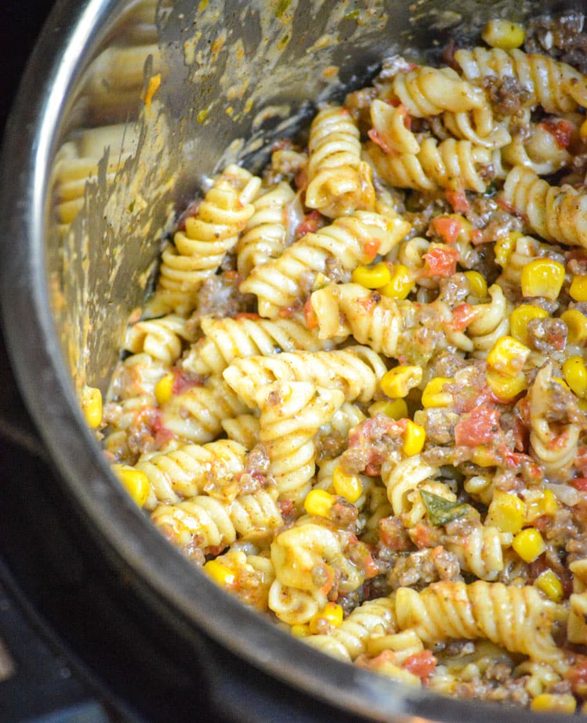 cheesy taco pasta in the liner of an instant pot
