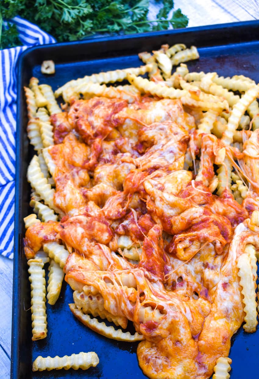viral tiktok pizza fries on a metal baking sheet
