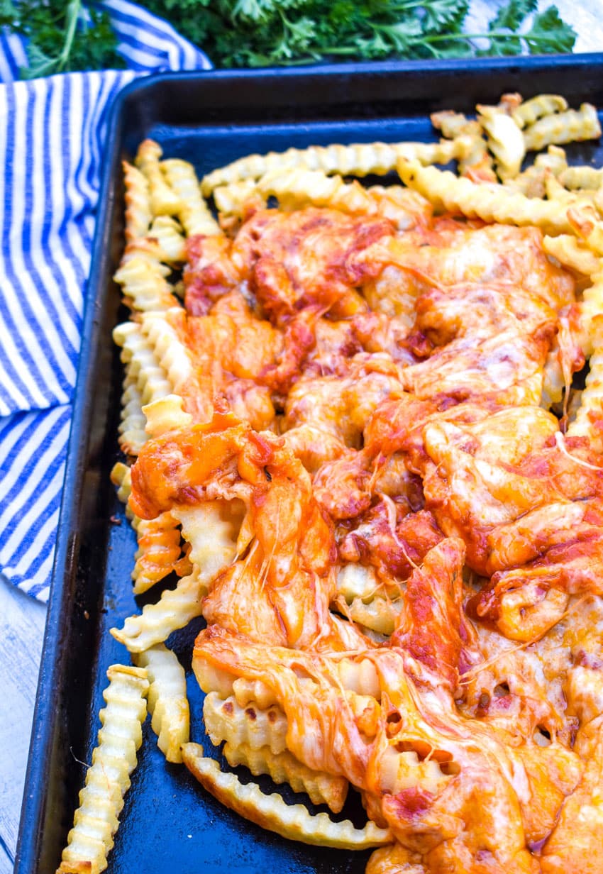 viral tiktok pizza fries on a metal baking sheet