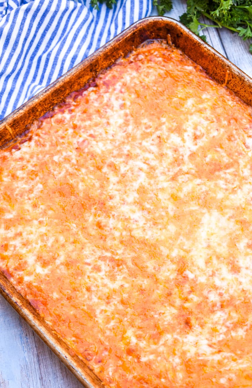 baked cheese on a metal sheet pan