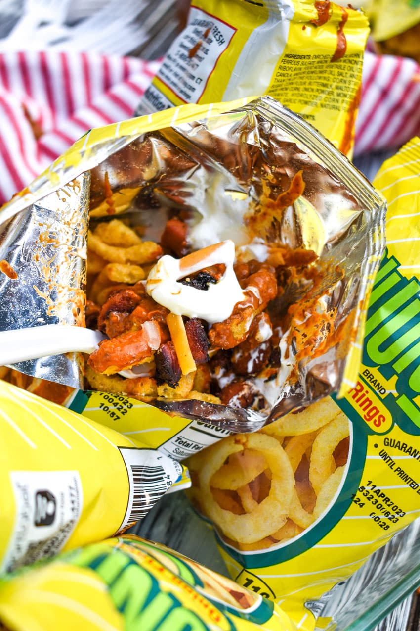 a white plastic fork in a walking chili cheese dog bag