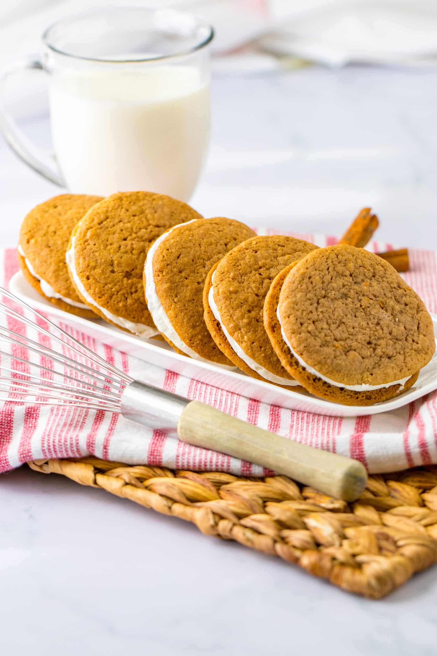 copycat oatmeal creme pies lined up in a row on a white serving tray