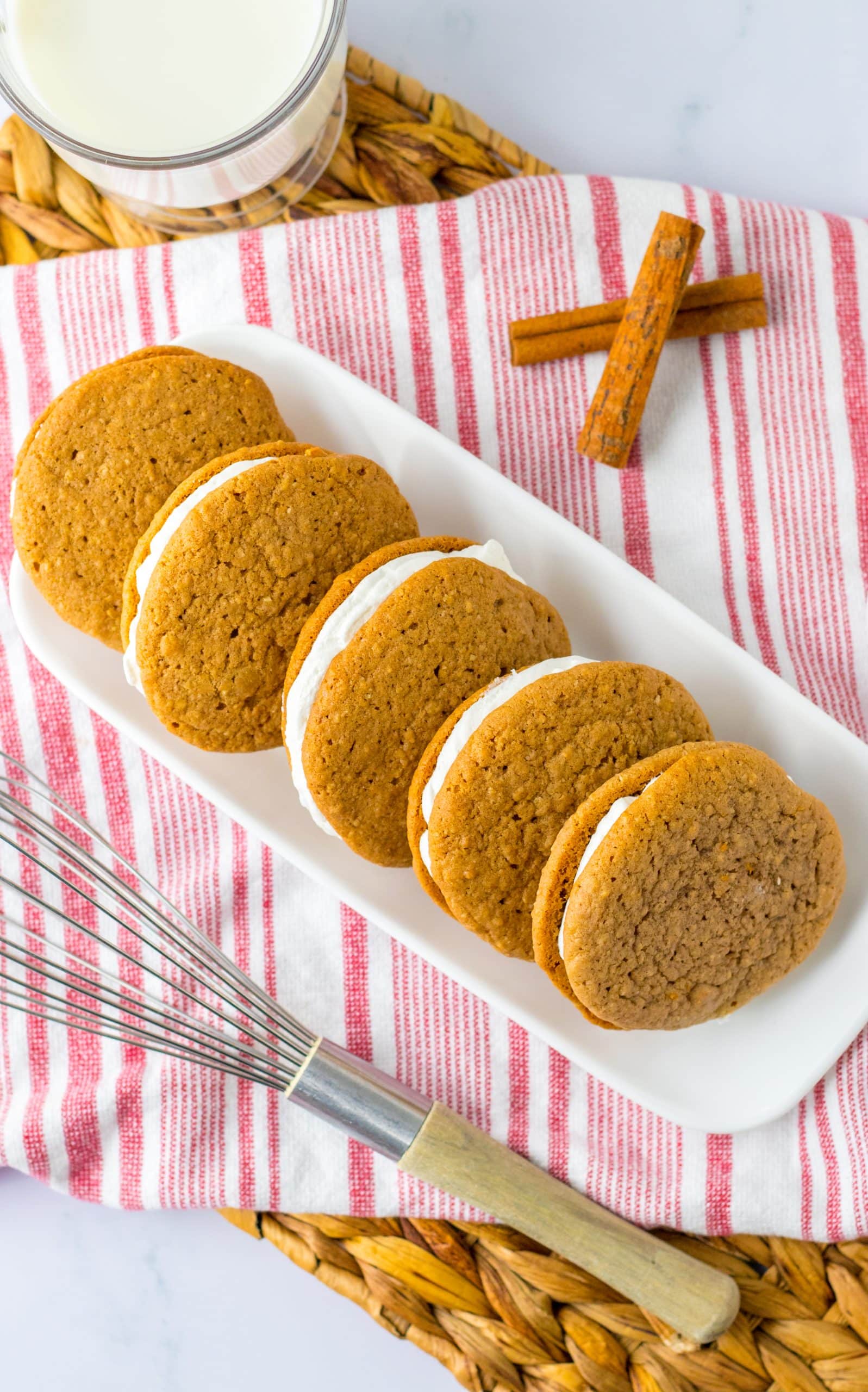 copycat oatmeal creme pies lined up in a row on a white serving tray