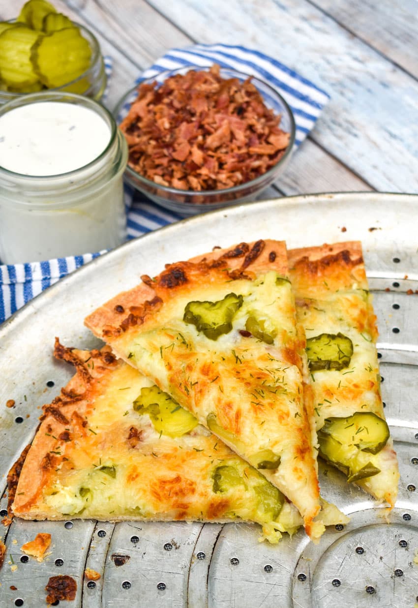 dill pickle pizza on a metal pizza pan