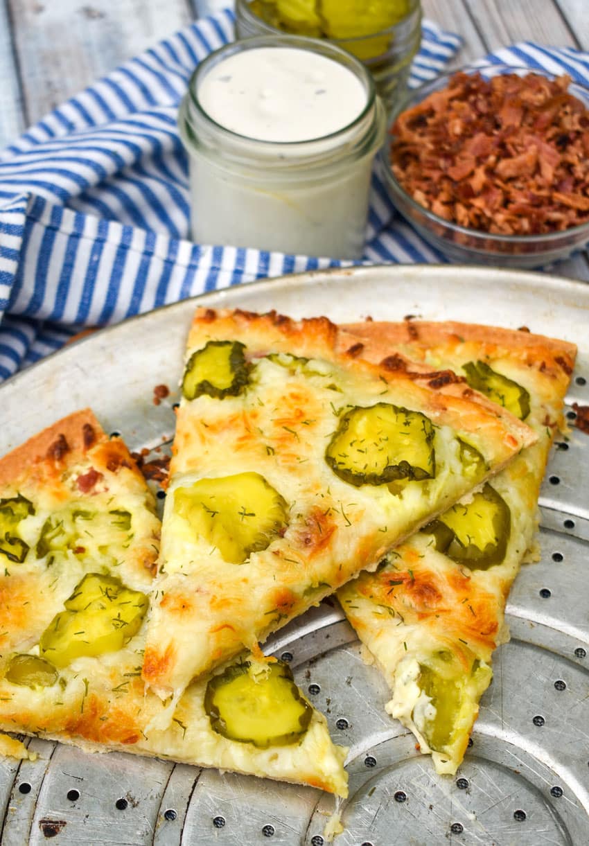 dill pickle pizza on a metal pizza pan