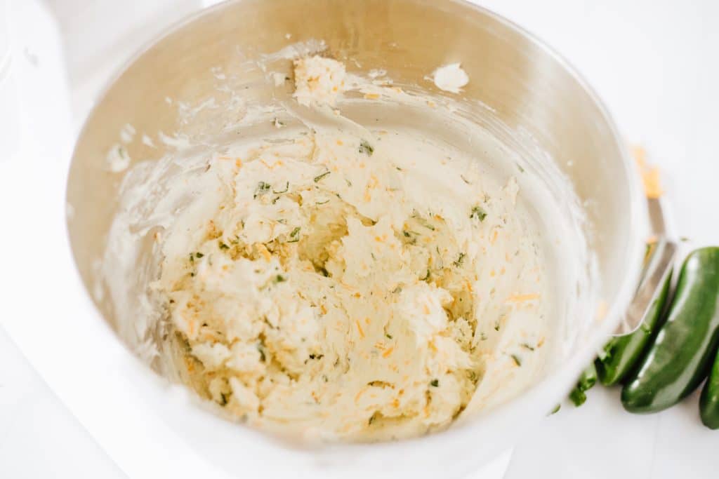 seasoned cream cheese filling in a metal mixing bowl