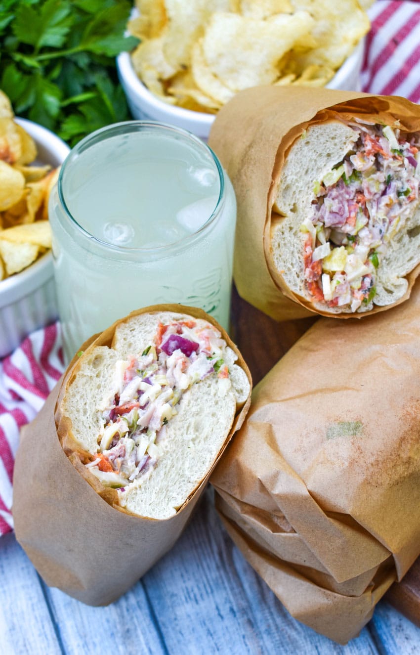 chopped italian sandwiches on a wooden table