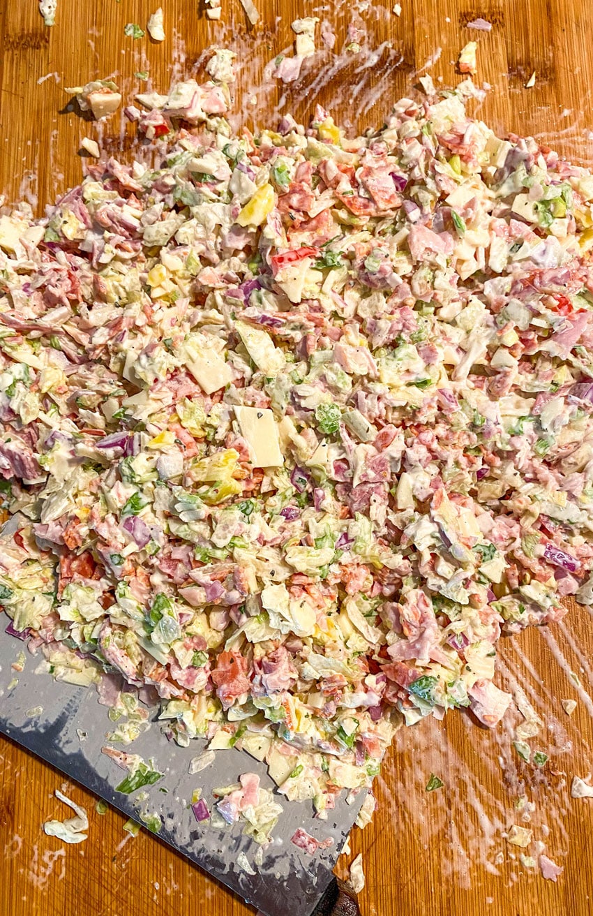Italian chop chop sub mixture on a wooden cutting board