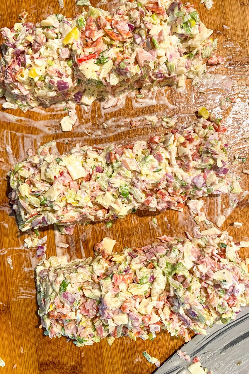 Italian chop chop sub mixture on a wooden cutting board