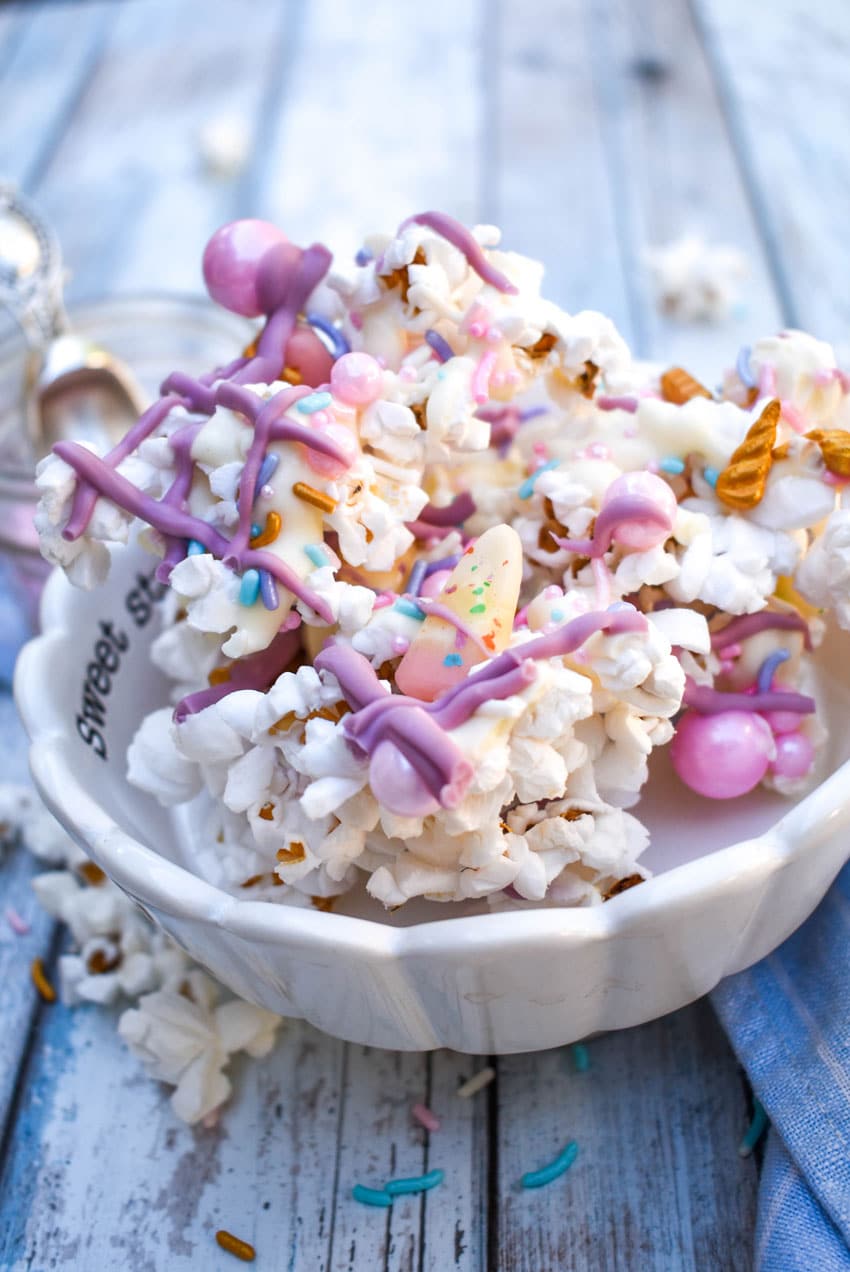 unicorn popcorn recipe in a small white candy dish