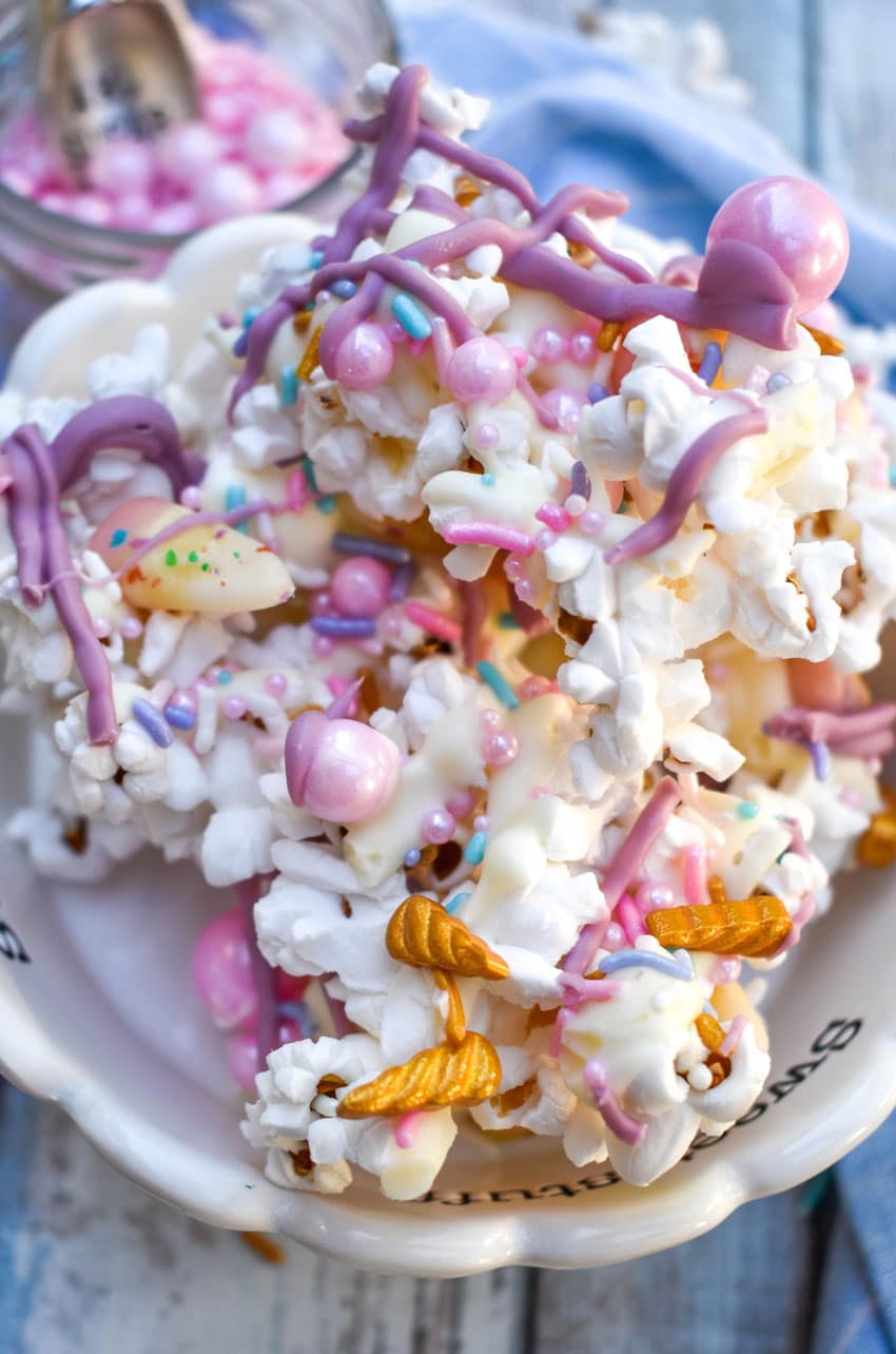 unicorn popcorn recipe in a small white candy dish
