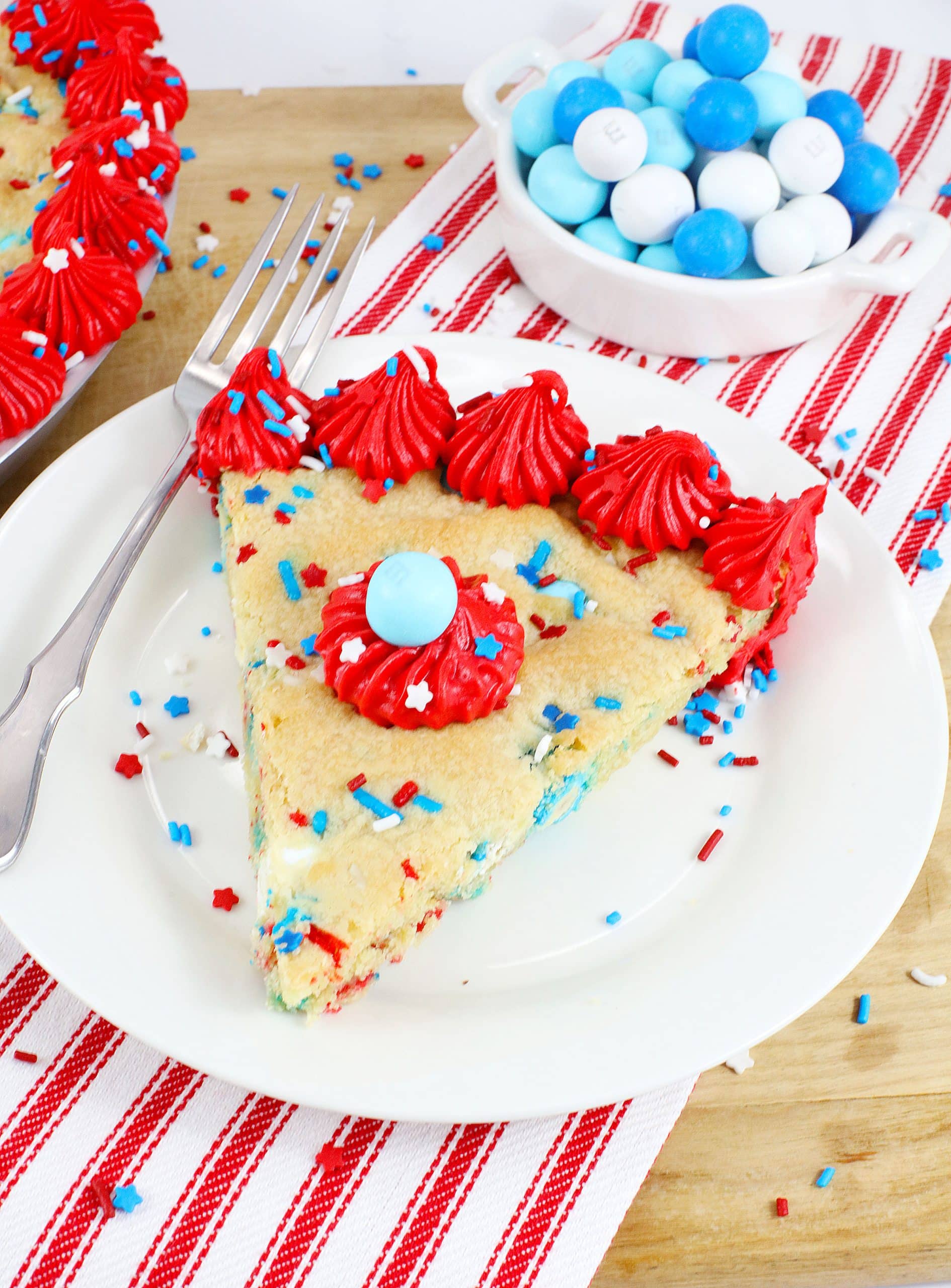red white and blue cookie cake on a white plate