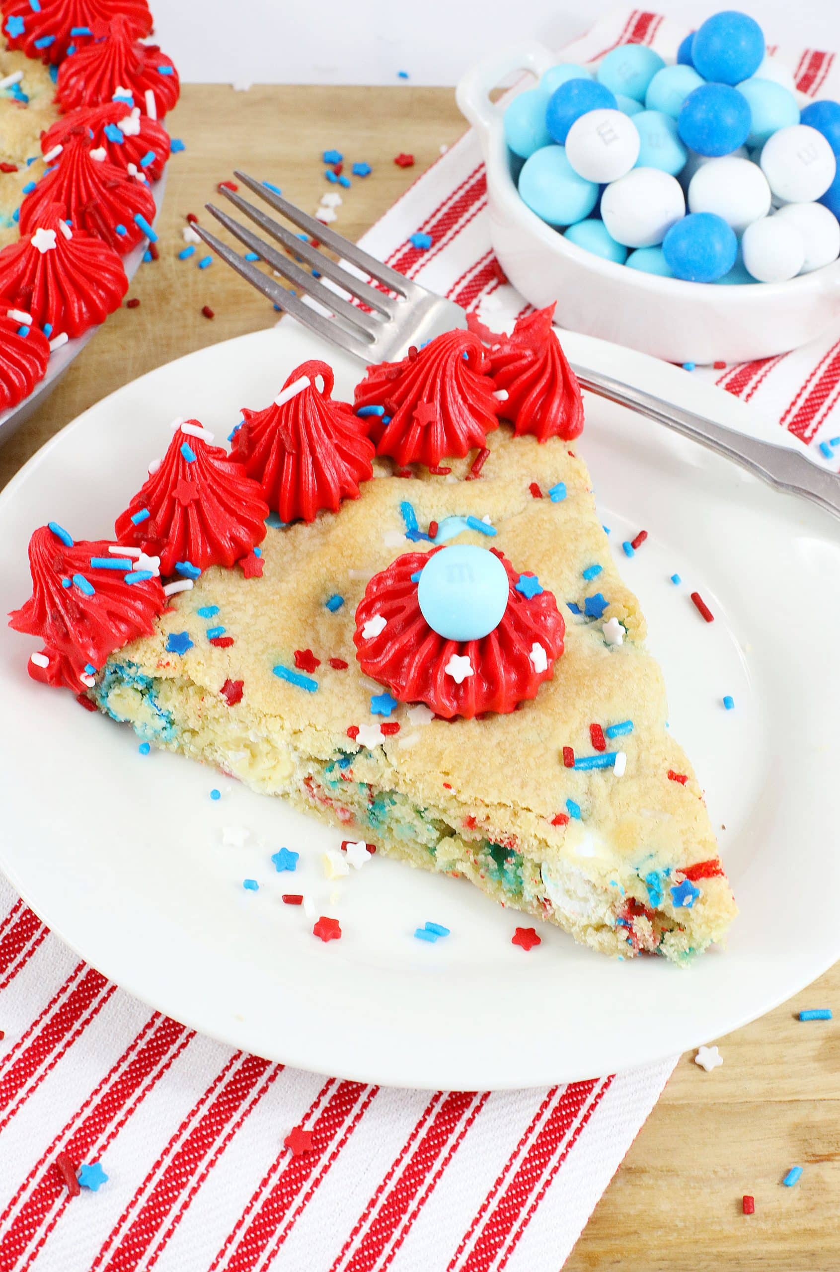 red white and blue cookie cake on a white plate