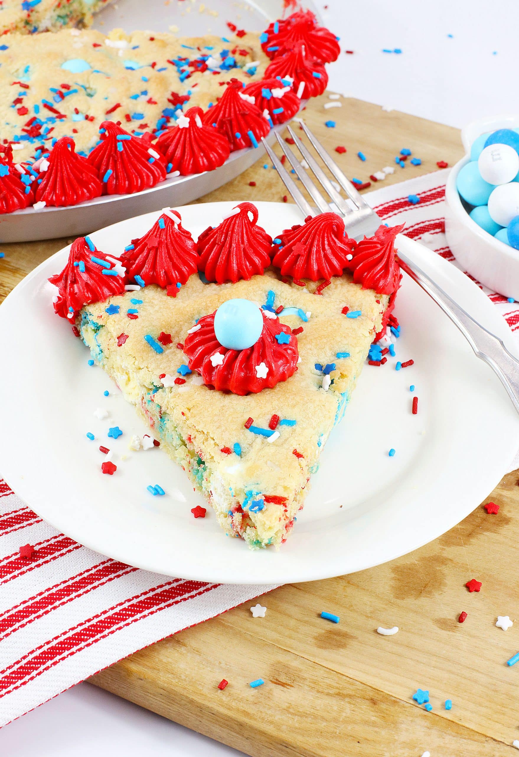red white and blue cookie cake on a white plate