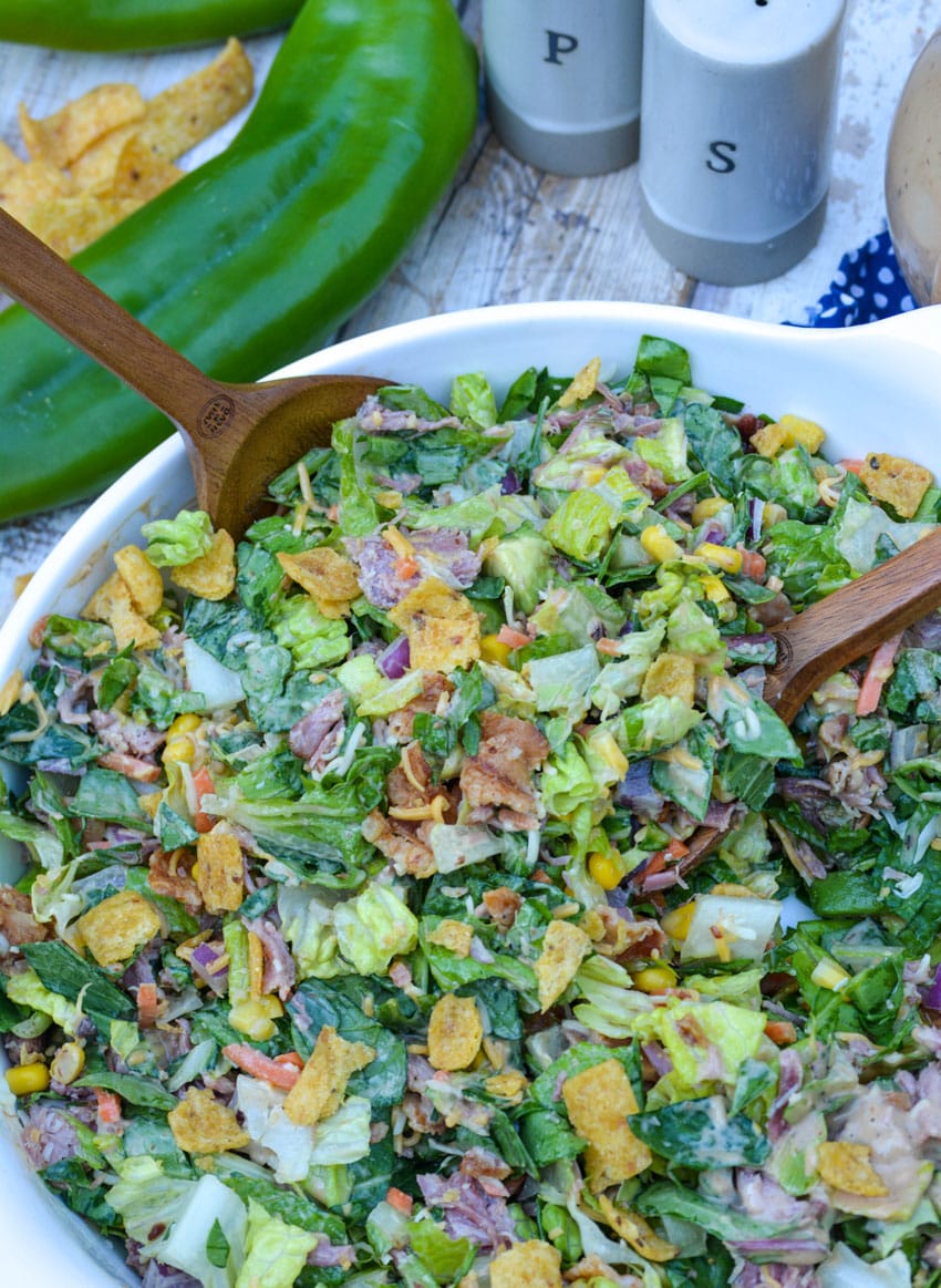 barbecue ranch chopped salad in a white serving bowl
