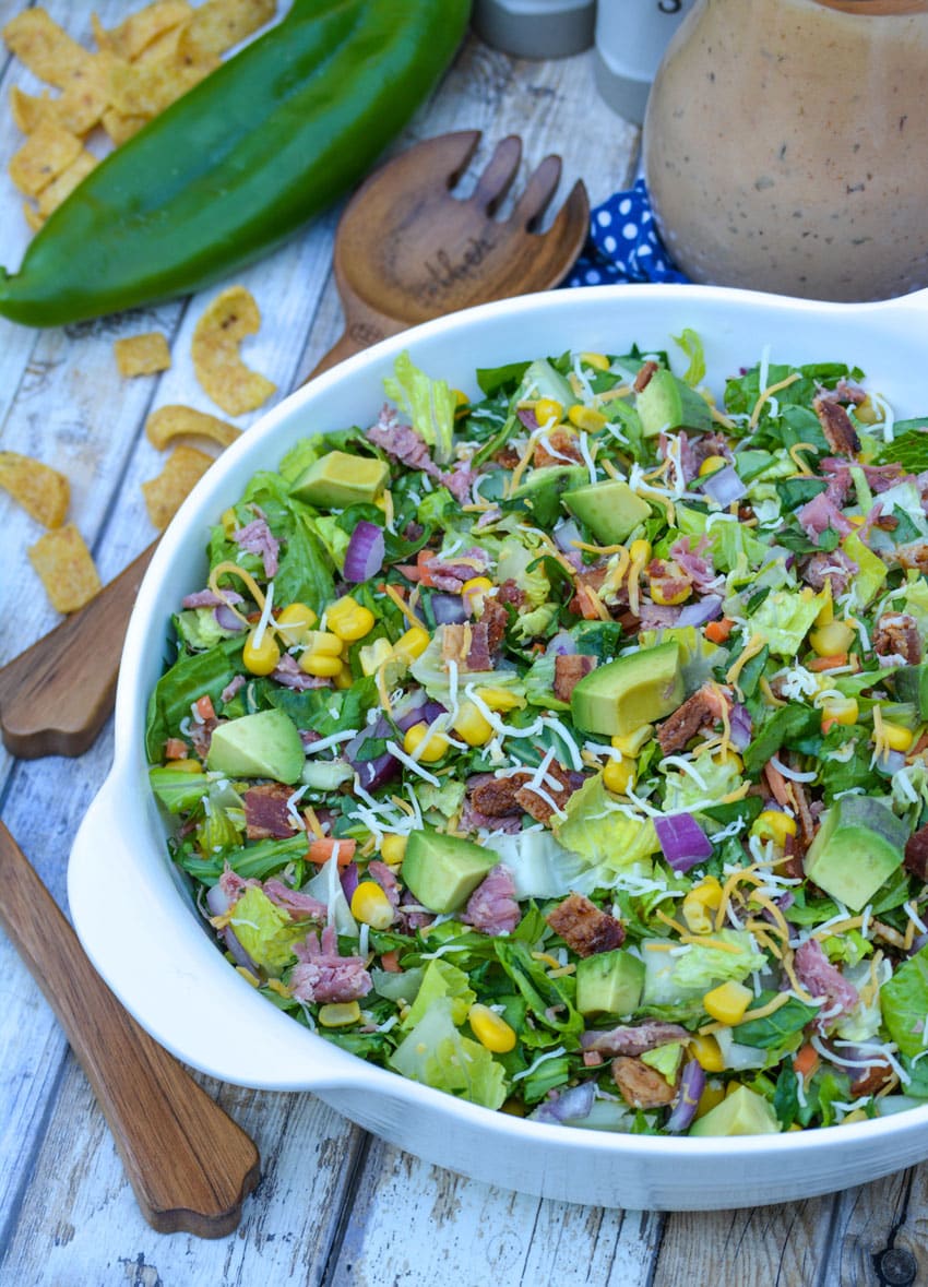 barbecue ranch chopped salad in a white serving bowl