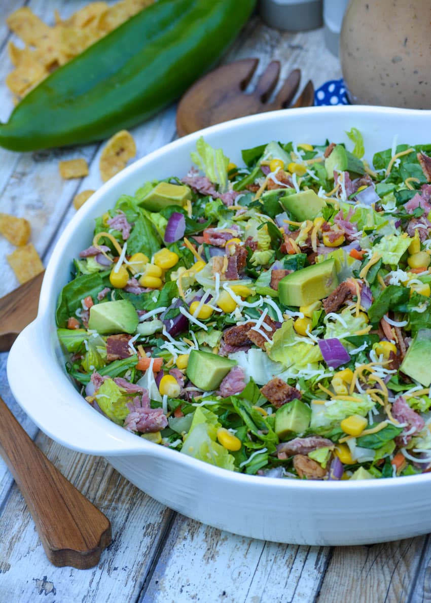barbecue ranch chopped salad in a white serving bowl
