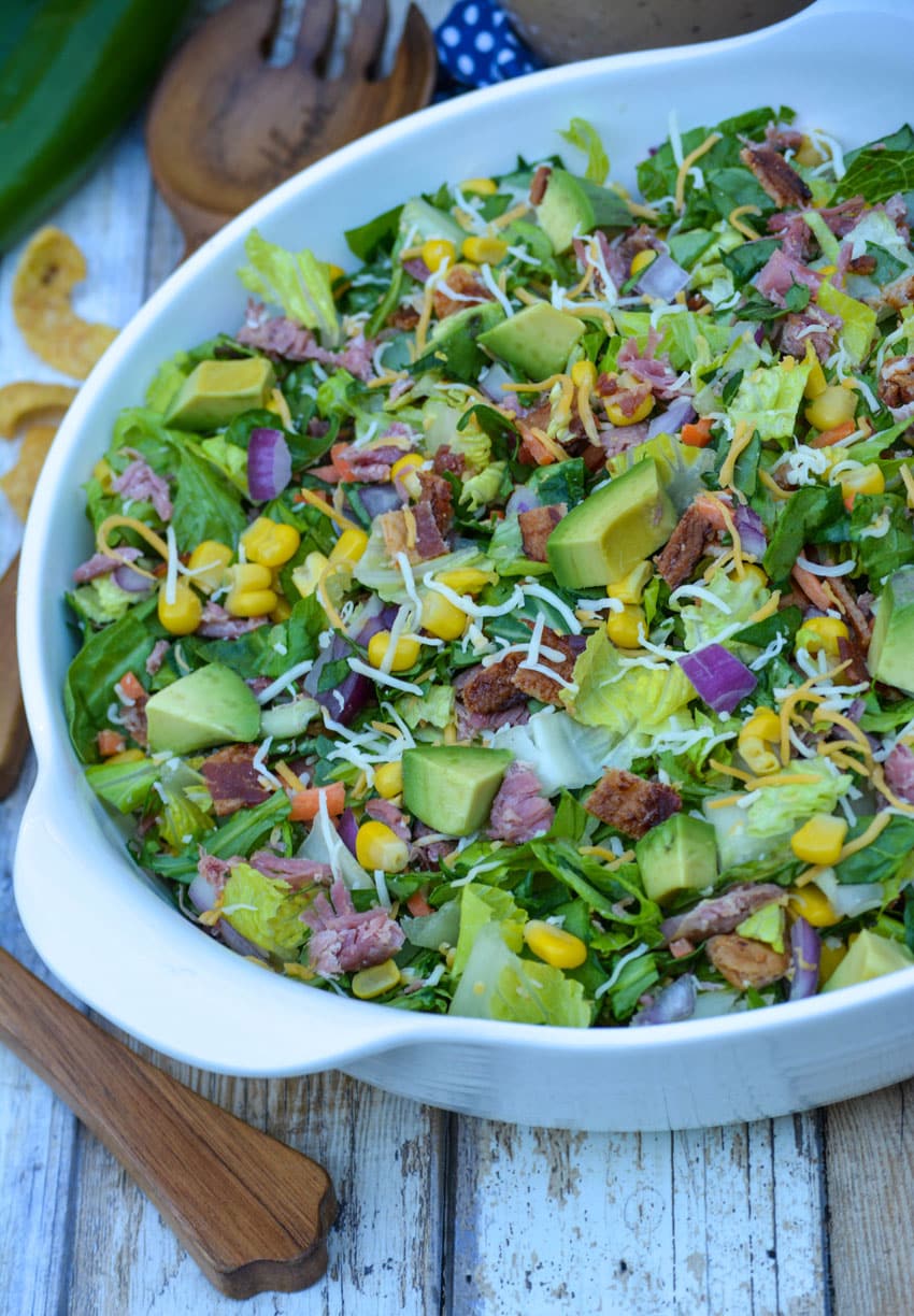 barbecue ranch chopped salad in a white serving bowl