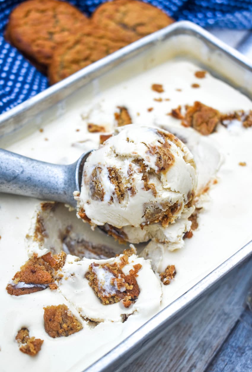 a silver scoop scooping no churn oatmeal creme pie ice cream from a metal pan