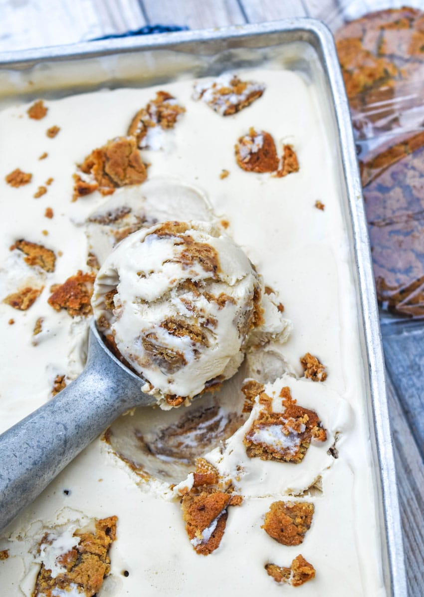 a silver scoop scooping no churn oatmeal creme pie ice cream from a metal pan