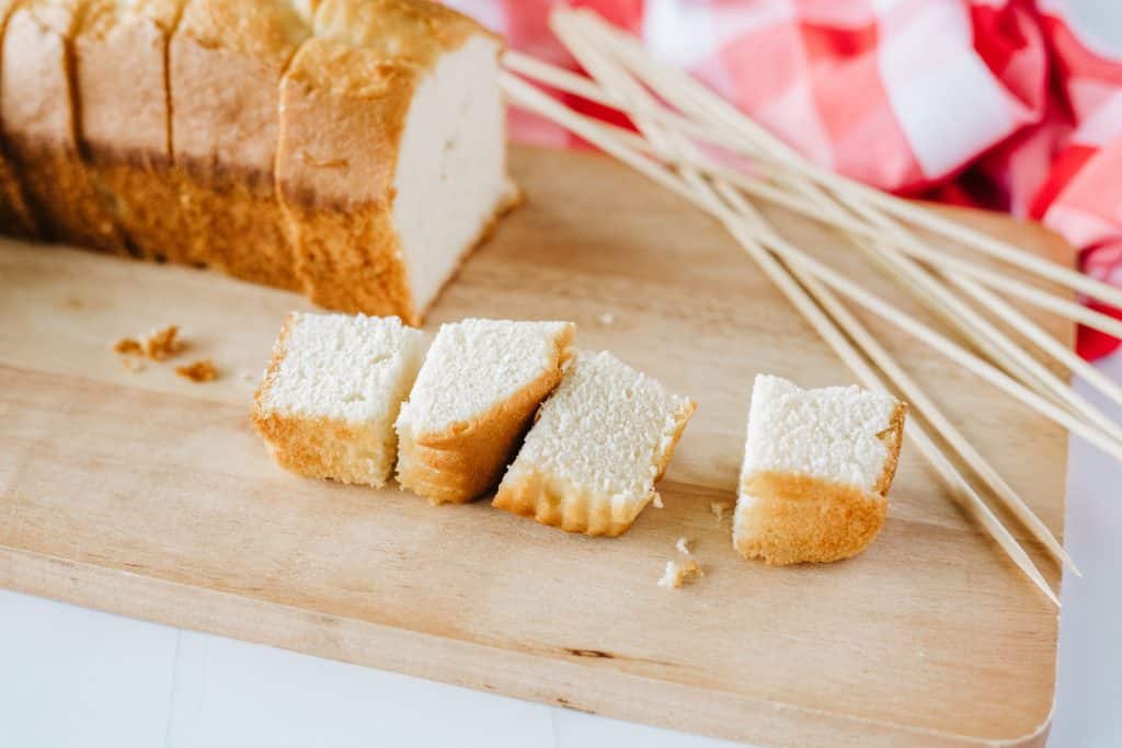 squares of pound cake on a wooden cutting board
