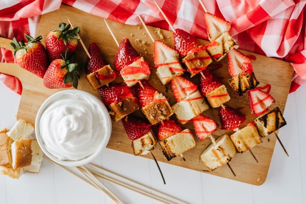 strawberry cake kabobs on a wooden skewer
