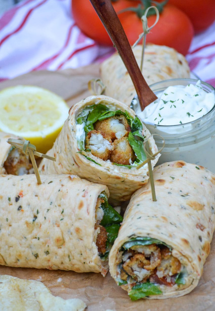 fish stick wraps cut in half and stacked together on parchment paper