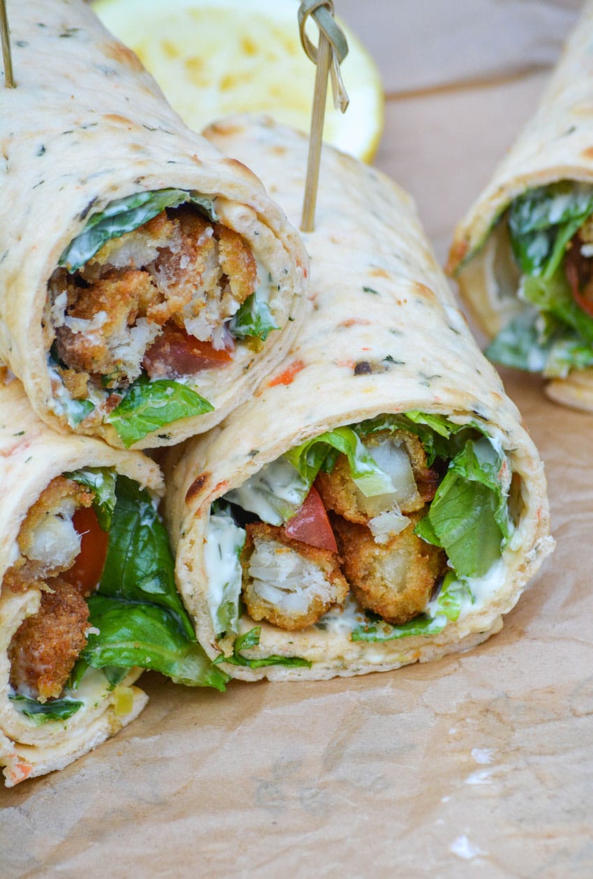 fish stick wraps cut in half and stacked together on parchment paper