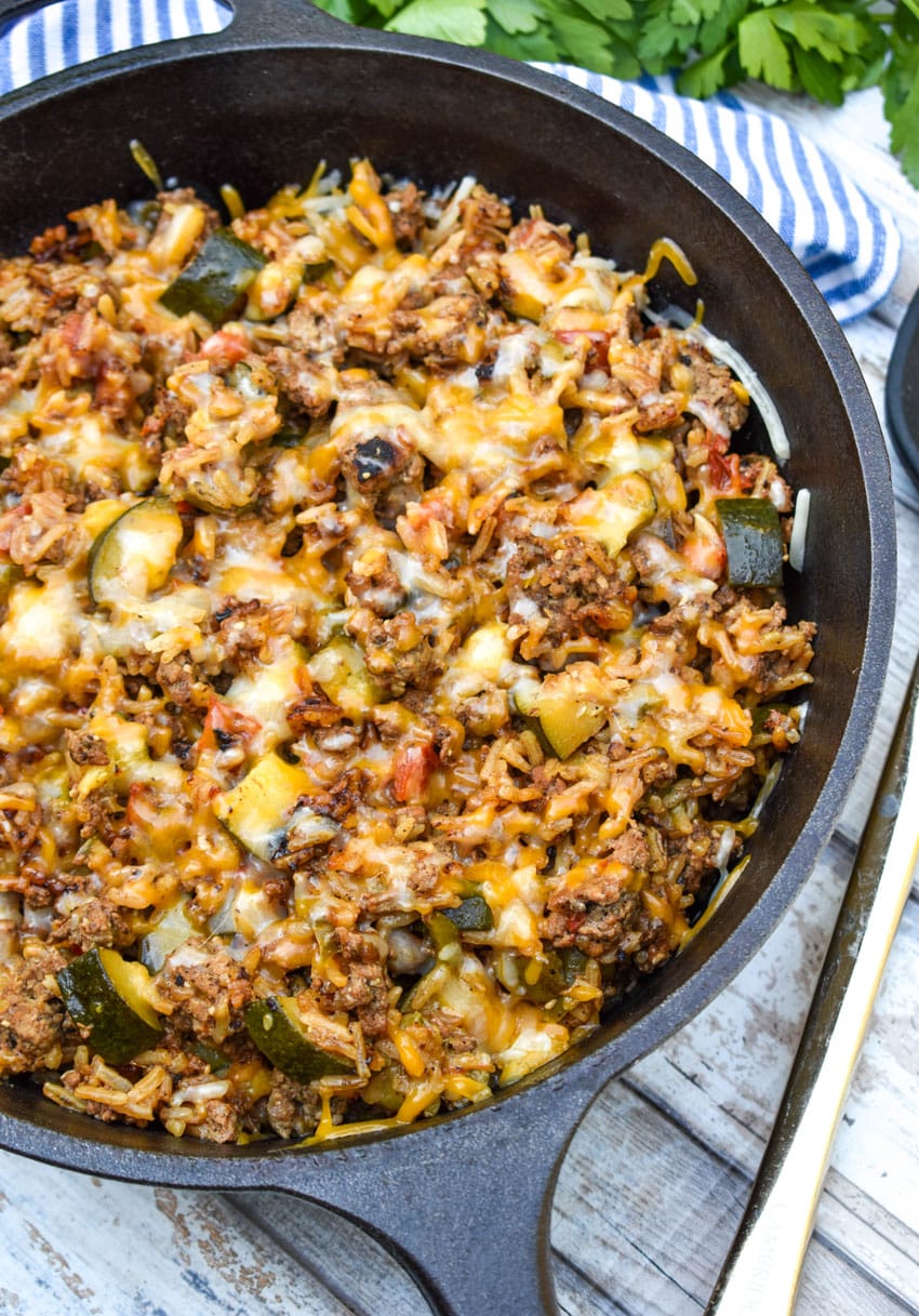 ground beef zucchini and rice skillet in a cast iron skillet