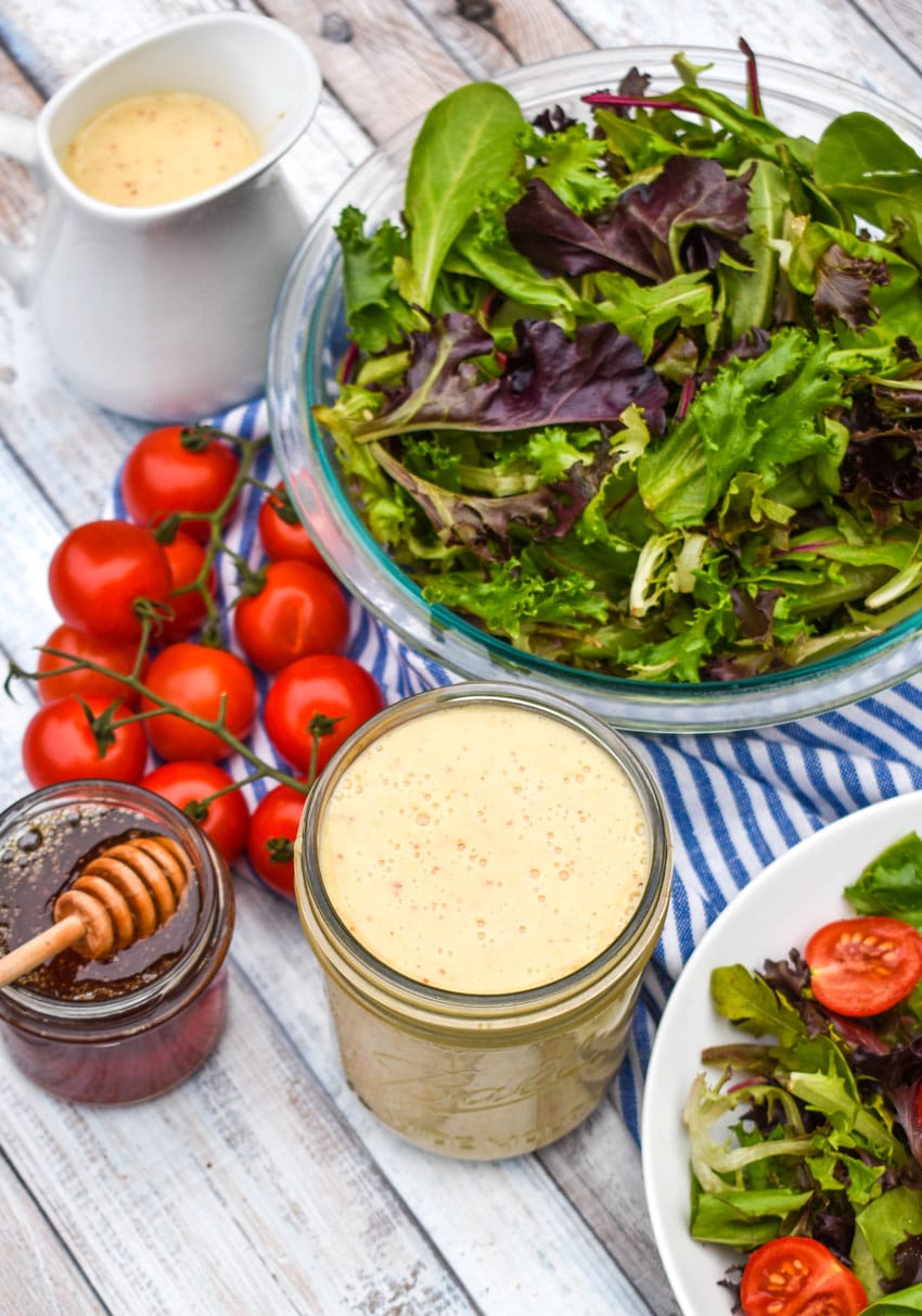 easy honey mustard dressing in a glass mason jar
