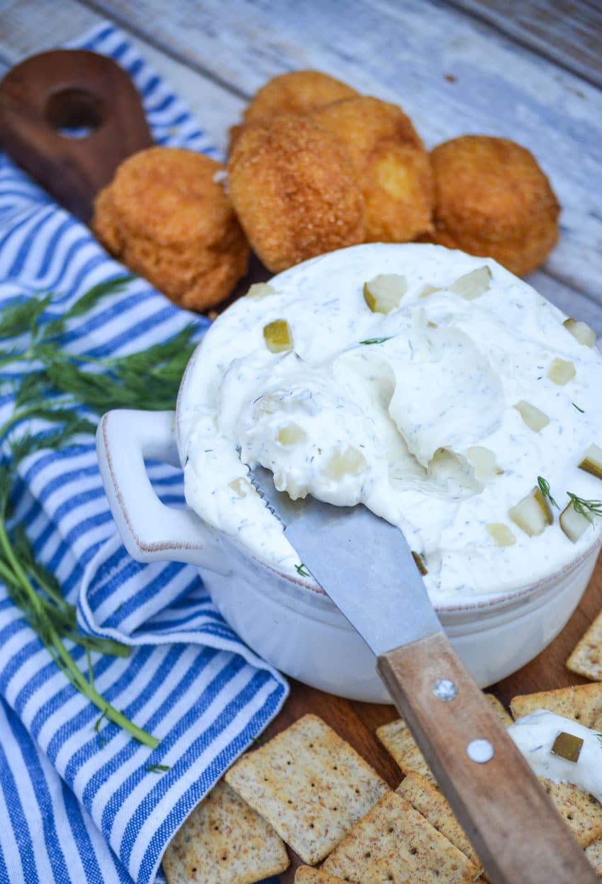 creamy dill pickle dip in a gray dish