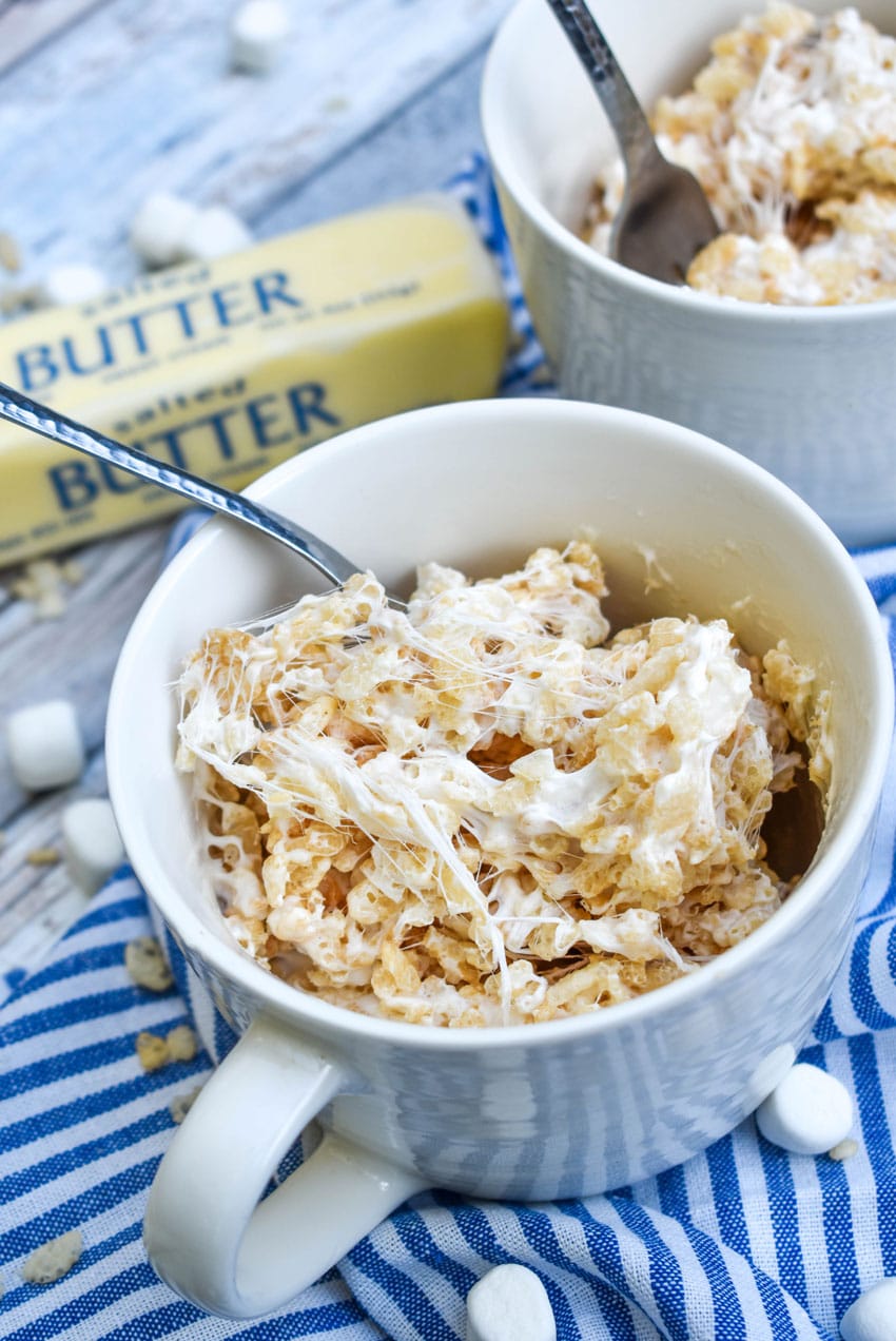 single serving rice krispie treats in two white mugs