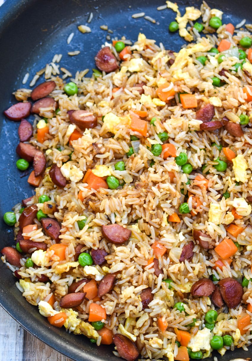 leftover hot dog fried rice in a black skillet