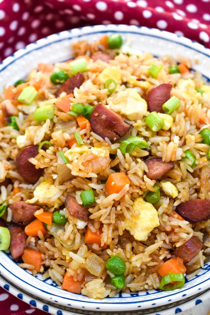 leftover hot dog fried rice in a white bowl