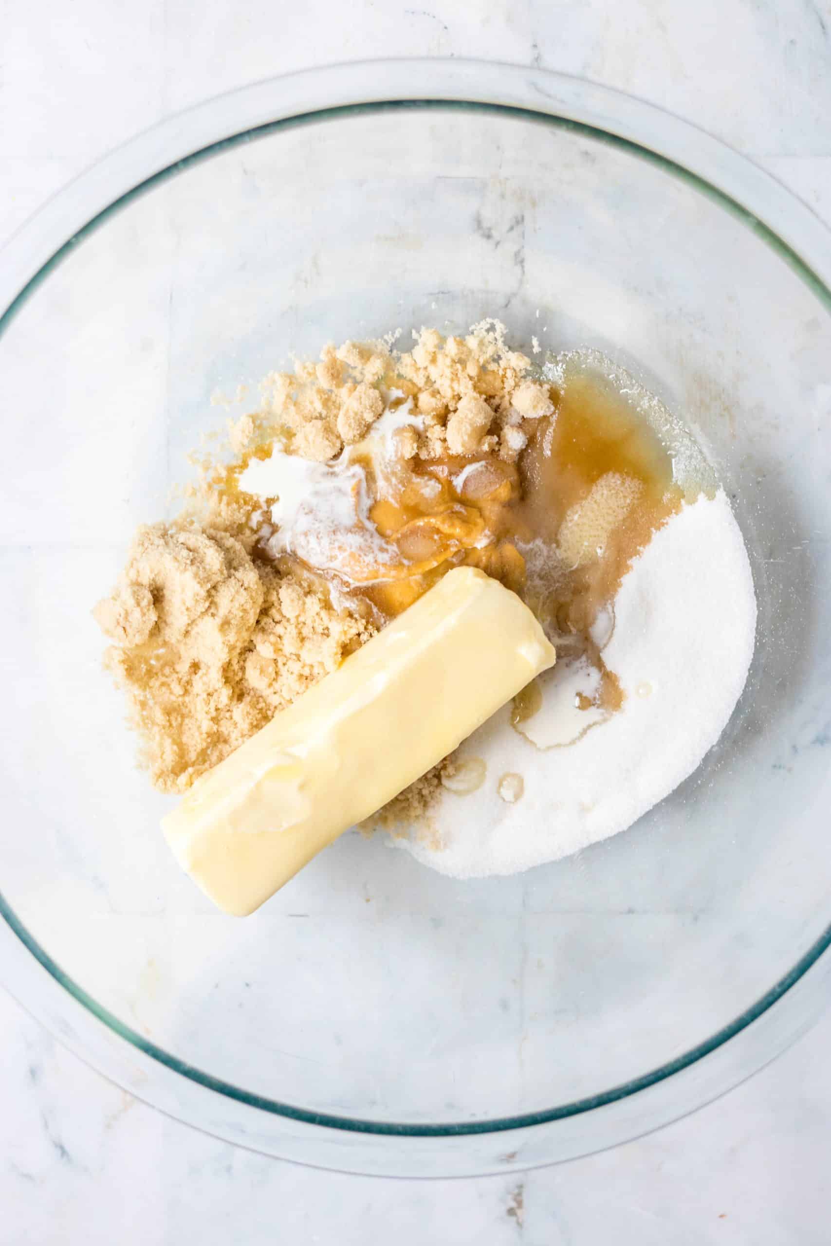 cookie batter ingredients in a large glass mixing bowl