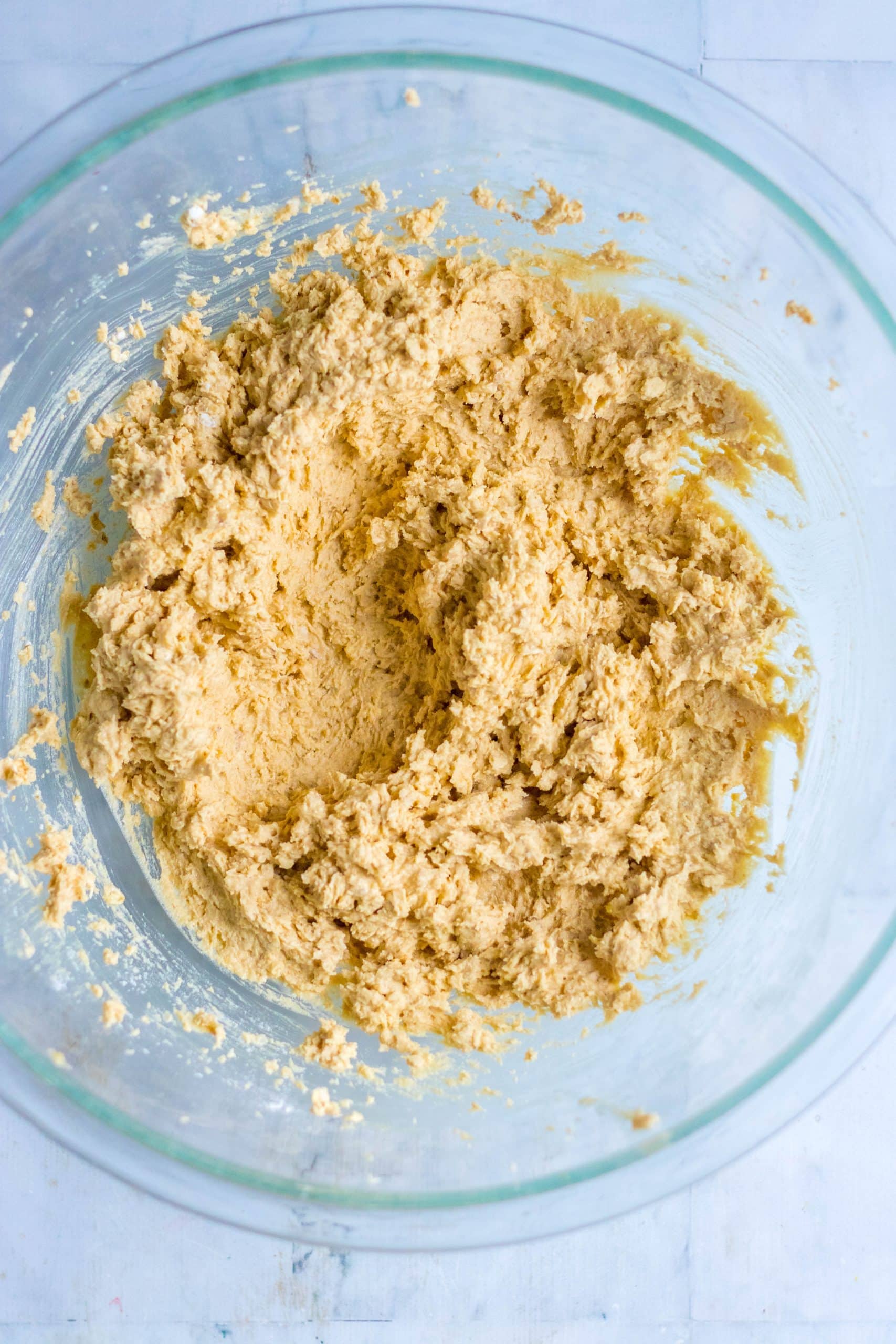 edible cookie dough batter in a large glass mixing bowl
