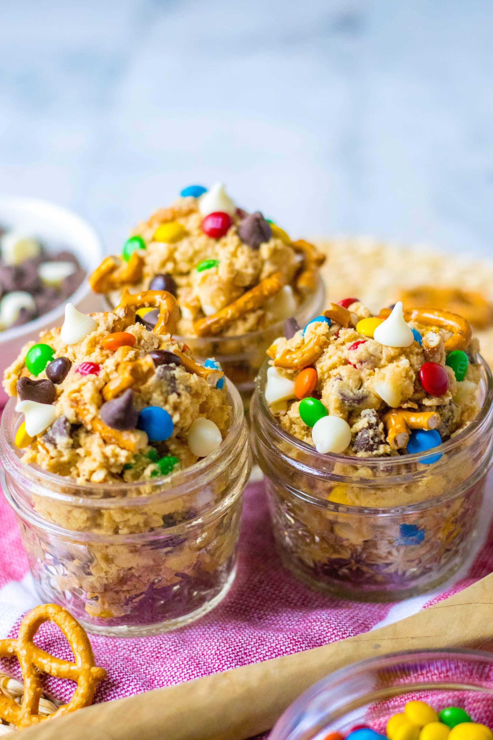 easy edible monster cookie dough in three small glass jars