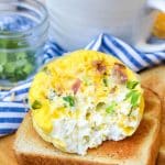 an omelet in a mug removed from the mug and resting on piece of crisp toast