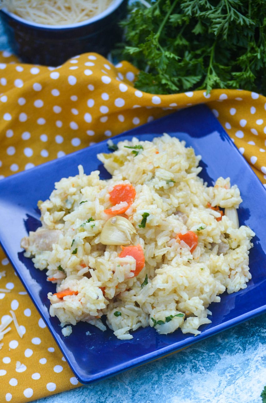 one pot chicken and rice with vegetables on a small blue square plate